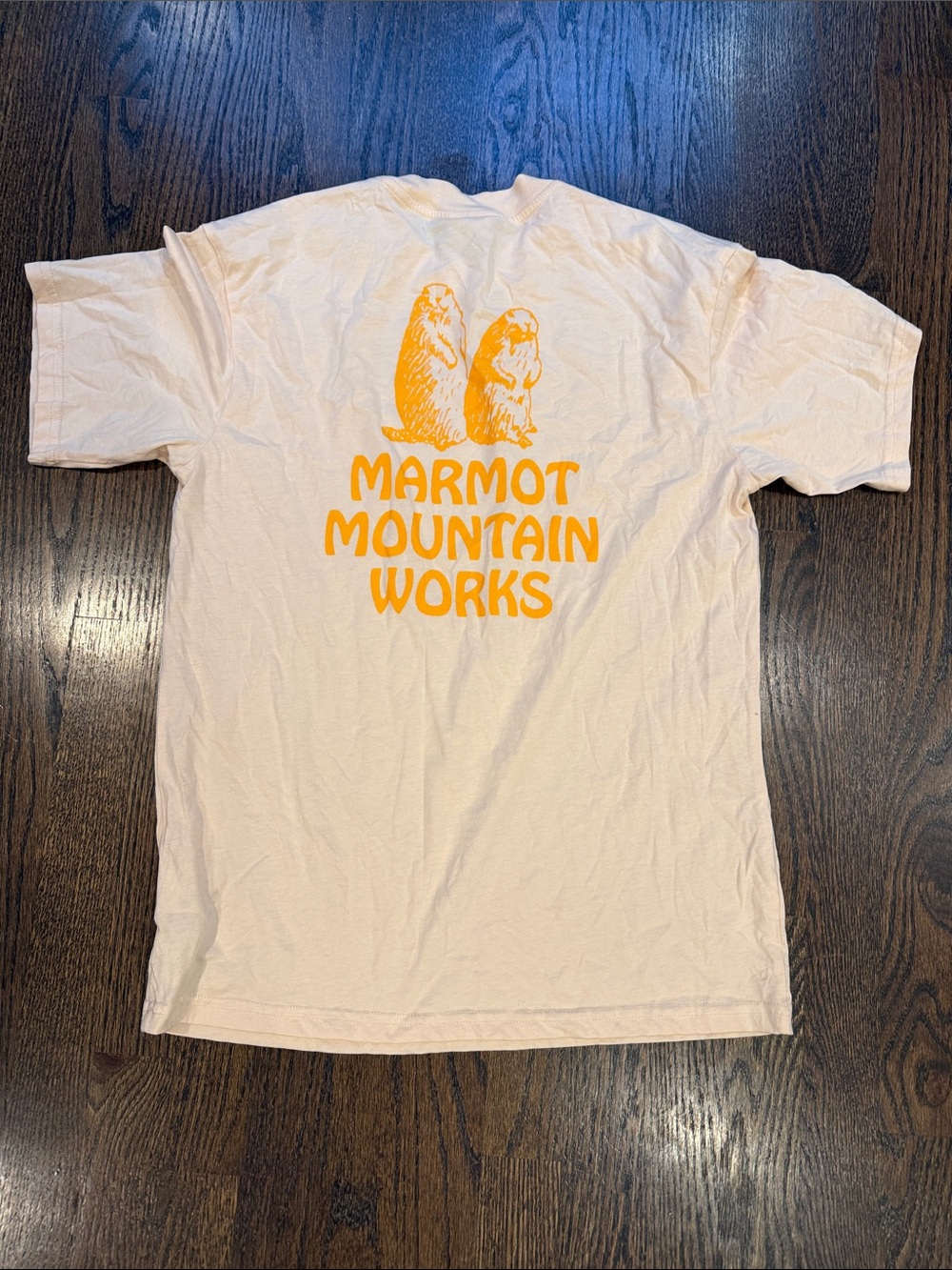 Marmot Cream Short Sleeve Tee with Orange Marmot Mountain Works Graphic